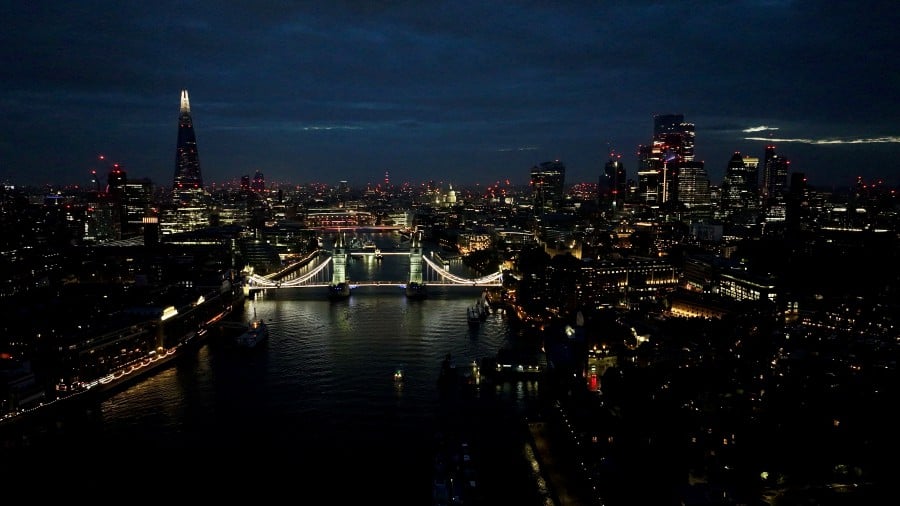 A drone view shows the Tower Bridge at night in London, Britain, June 15, 2024. REUTERS/Yann Tessier