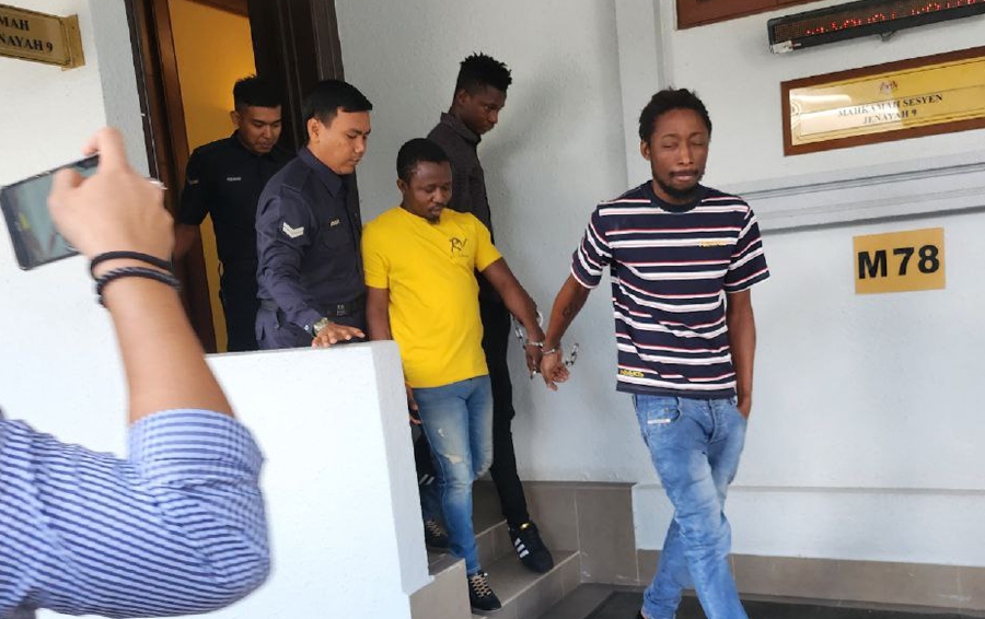 Three men from Sierra Leone claimed trial at the Sessions Court today to a joint charge of possessing four counterfeit US$100 notes earlier this month. — NSTP