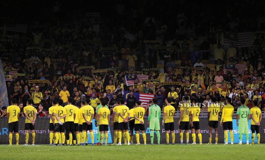 This file pic shows Harimau Malaya players paying tribute to fans after defeating Thailand in the World Cup/Asian Cup qualifiers at the National Stadium in Bukit Jalil on November 14, 2019. - NSTP file pic