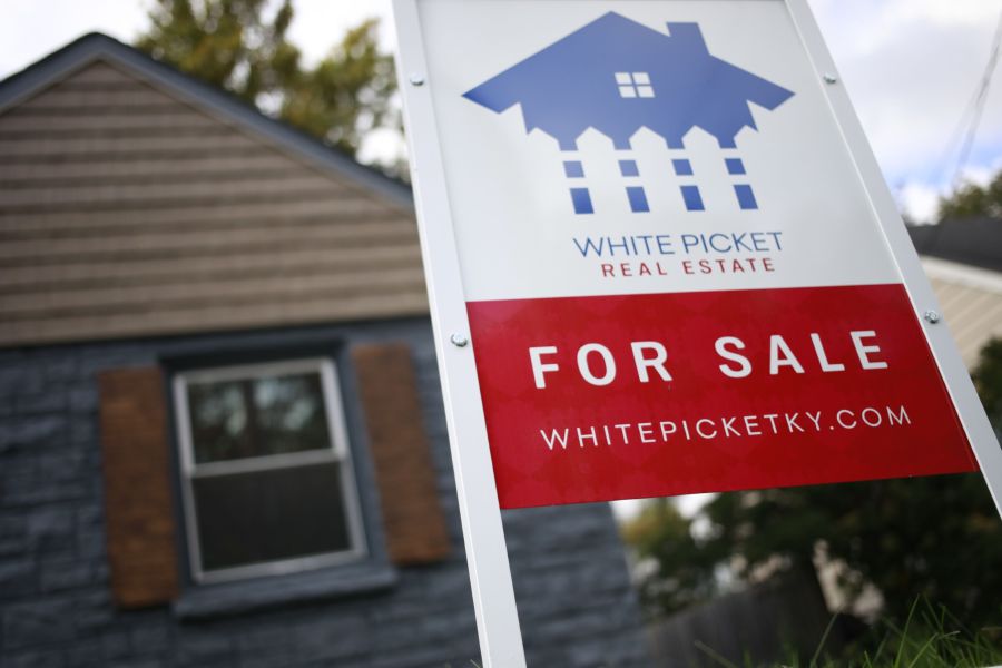 A "For Sale" sign outside a home in Louisville, Kentucky, U.S., on Tuesday, Oct. 26, 2021. The torrid pace of price gains has eased slightly after the pandemic ignited a buying frenzy for a tight supply of homes for sale across the U.S. Photographer: Luke Sharrett/Bloomberg