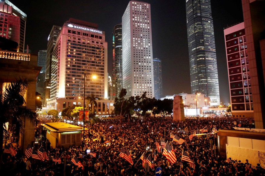 Anti-government demonstrators march in protest against the invocation of the emergency laws in Hong Kong, China. - Reuters
