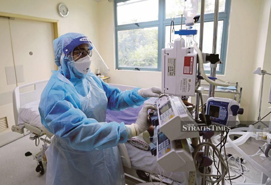 A file pic showing a nurse attending to a patient a hospital in Kuala Lumpur. - NSTP file pic 