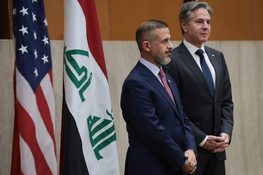 U.S. Secretary of State Antony Blinken (R) and Iraqi Deputy Prime Minister Muhammad Ali Tamim (L) wait to speak at the State Department April 15, 2024 in Washington, DC. -AFP PIC