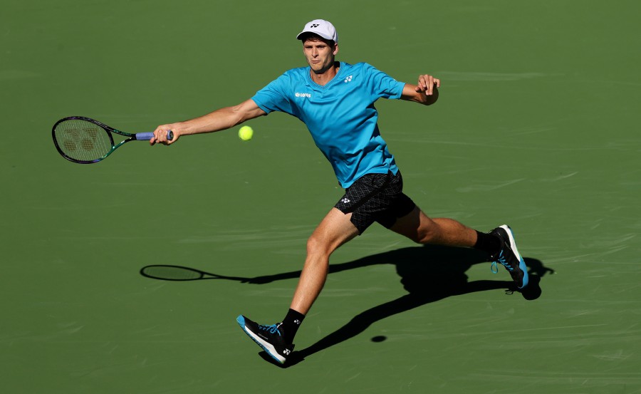 Hubert Hurkacz of Poland plays a forehand against Grigor Dimitrov of Bulgaria during their quarterfinal match on Day 11 of the BNP Paribas Open at the Indian Wells Tennis Garden on October 14, 2021 in Indian Wells, California. - AFP PIC