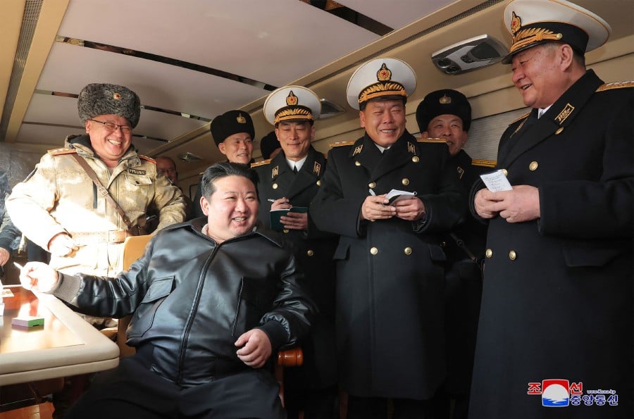 North Korean leader Kim Jong Un inspecting the evaluation test-fire of new-type surface-to-sea missile Padasuri-6 to be equipped by the navy, at an undisclosed location in North Korea. (Photo by KCNA VIA KNS / AFP) 