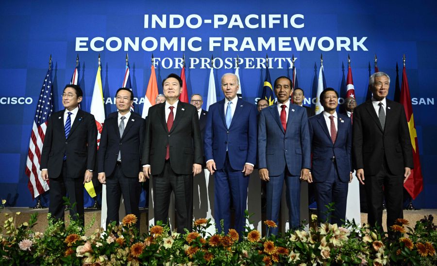 US President Joe Biden stands for a family photo while meeting with members of the Indo Pacific Economic Framework (IPEF) at the Asia-Pacific Economic Cooperation (APEC) Leaders' Week in San Francisco, California, on November 16, 2023. - AFP file pic