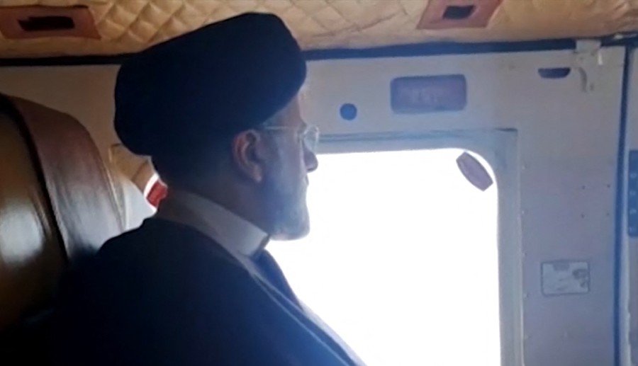 This grab taken from handout video footage released by the IRINN Iranian state television network on May 19, 2024 shows Iran's President Ebrahim Raisi on board a helicopter in the Jolfa region of the western province of East Azerbaijan. - AFP PIC