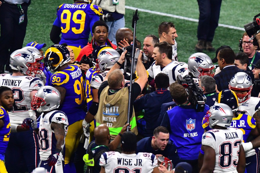 New England Patriots wide receiver Julian Edelman and Tom Brady celebrate  after the game against the Los Angeles Rams at Super Bowl LIII at  Mercedes-Benz Stadium on February 3, 2019 in Atlanta.