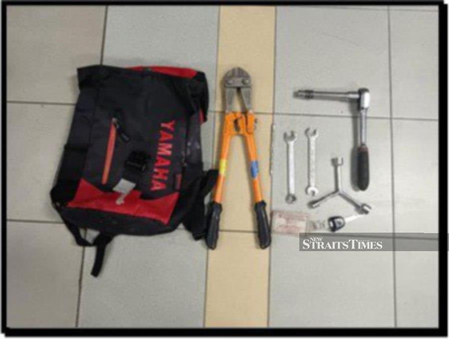 Police seized break-in tools, including modified long hooks believed to be used to fish out banknotes from mounted donated boxes in mosques. 