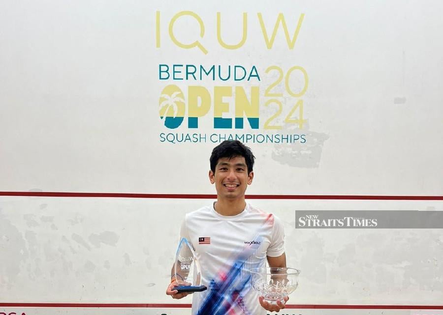 Sanjay Jeeva posing with his Bermuda Open trophy.