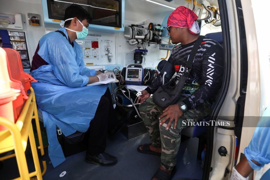 One of the rescued victim undergoes health screening at the MMEA jetty in Kuala Terengganu. - NSTP/GHAZALI KORI