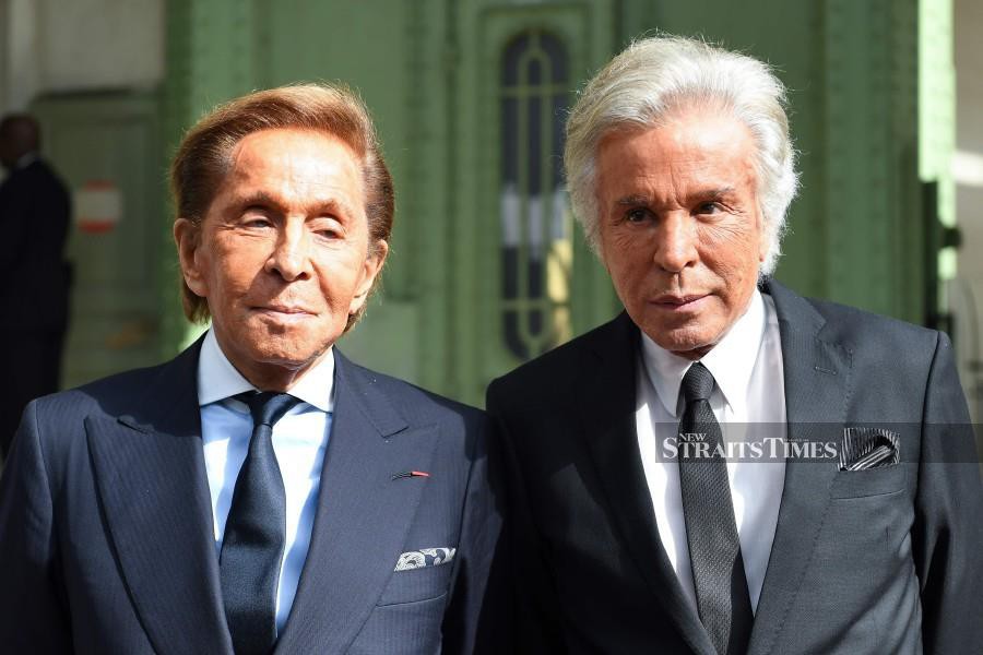 Italian fashion designer Valentino Garavani (L) and Italian business man Giancarlo Giammetti (R) arrive for the “Karl For Ever” event to honour late German fashion designer Karl Lagerfeld at the Grand Palais in Paris. (AFP)