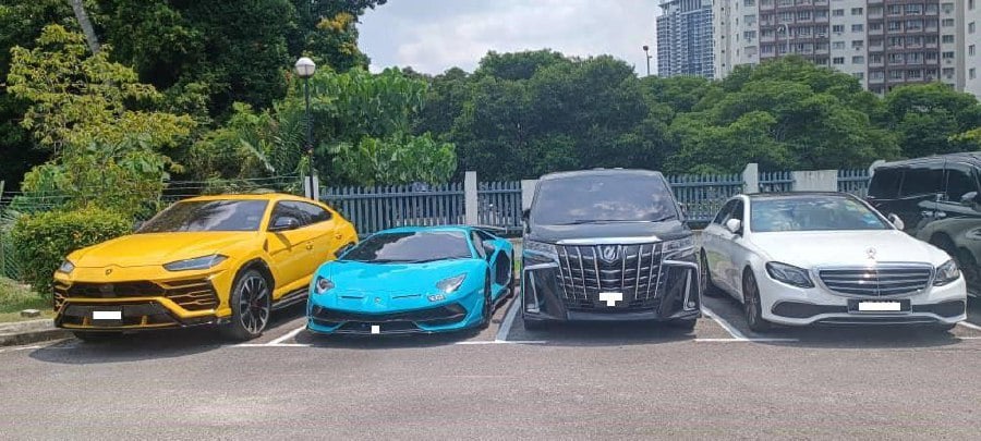 Some of the luxury vehicles seized by the Malaysian Anti-Corruption Commission in the course of investigations into a smuggling syndicate which bribed civil servants. MACC is now looking for one Mohammad Zyed Ibrahim, a government employee they believe can help investigations. File picture courtesy of MACC