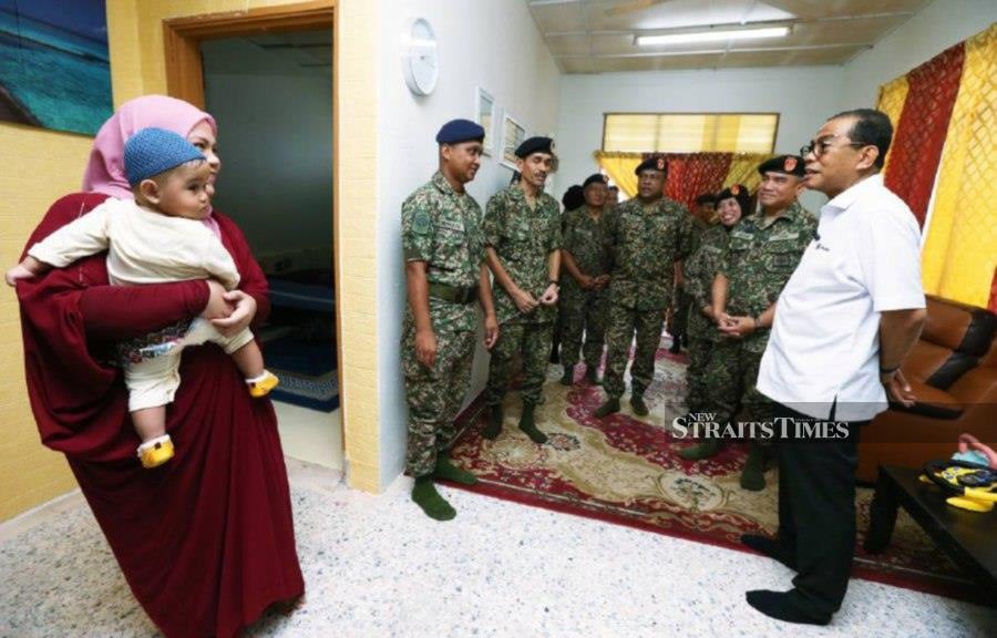 Datuk Seri Mohamed Khaled Nordin visiting the Rumah Keluarga Angkatan Tentera (RKAT) in Taman Seruling. -NSTP/ROHANIS SHUKRI