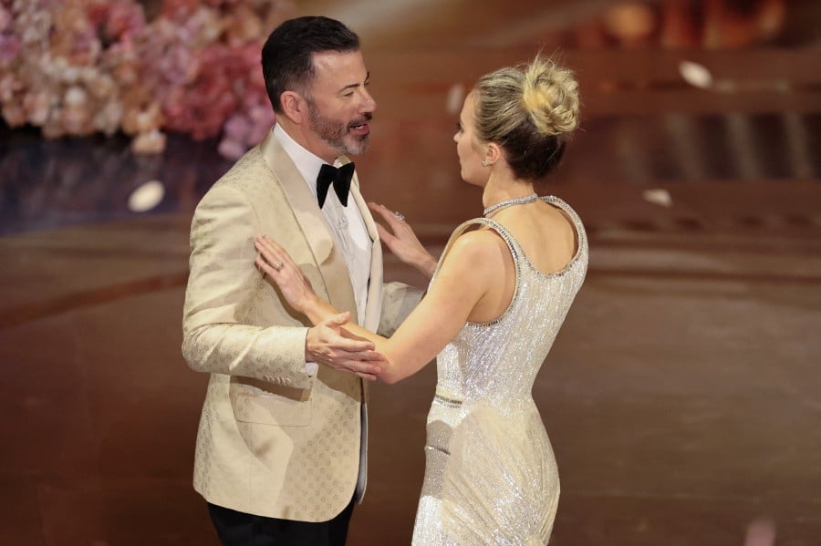 Jimmy Kimmel and Emily Blunt stands on stage after the Oscars show at the 96th Academy Awards in Hollywood, Los Angeles, California. - REUTERS PIC