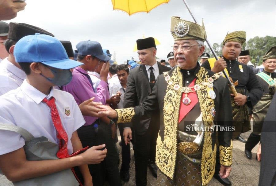 Yang di-Pertuan Agong Al-Sultan Abdullah Ri'ayatuddin Al-Mustafa Billah Shah mingles with the public upon arriving at the Royal Malaysian Air Force (RMAF) Air Base in Kuantan, Pahang.-NSTP/ MOHD RAFI MAMAT