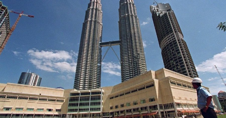 KLCC Property Holdings Bhd Stapled Group invests, develops, owns and manages a portfolio of premium assets comprising office, retail and hotel properties in Kuala Lumpur.  AFP Photo
