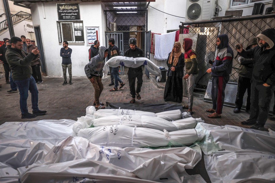 The shrouded bodies of people killed in Rafah during Israeli bombardment on the southern Gaza strip, are placed outside Al-Najar hospital. - AFP PIC
