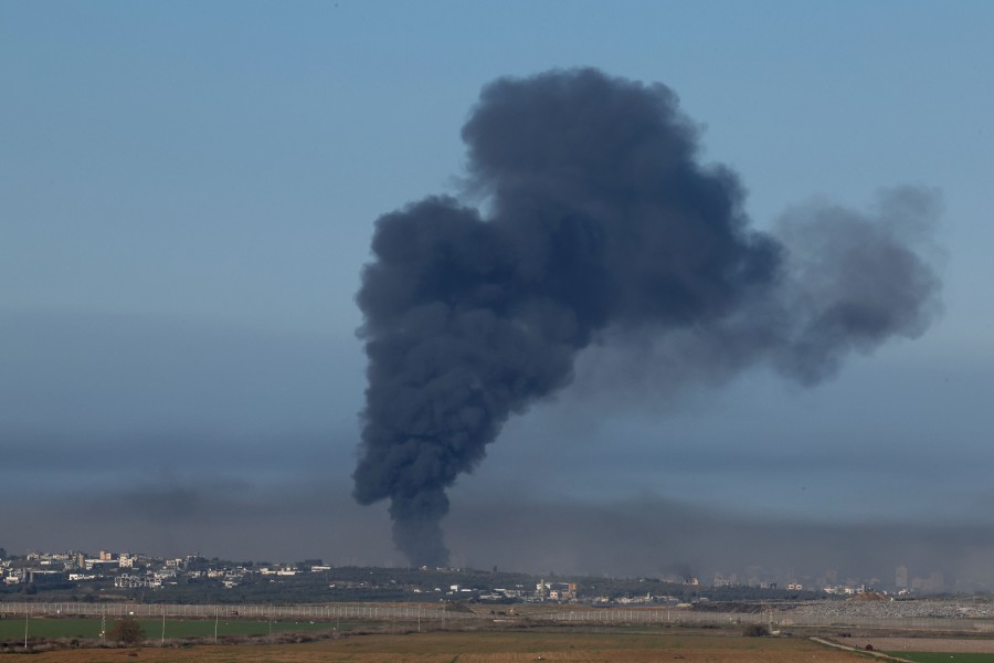 A picture taken from a position in southern Israel, along the border with the Gaza Strip, shows smoke billowing over the Palestinian territory during Israeli bombardment. - AFP PIC