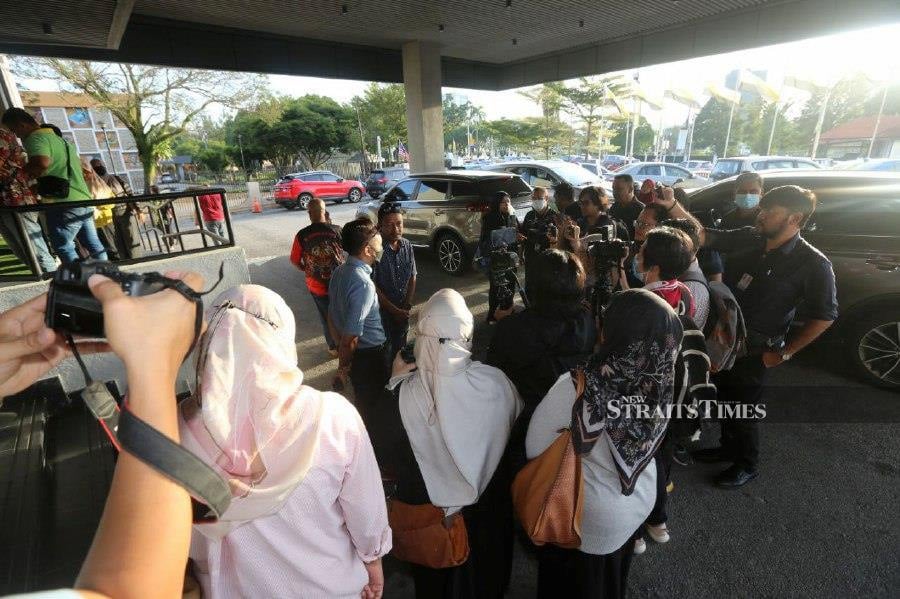 A family member of the victim, is seen speaking to the press at the Ipoh magistrate’s court, before the start of the trial. - NSTP/L. Manimaran.