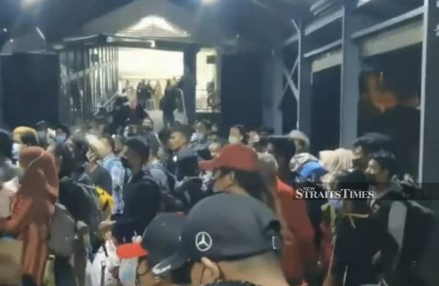 Some of the stranded passengers at the Kuah Ferry Terminal. - Pic courtesy of NST reader.