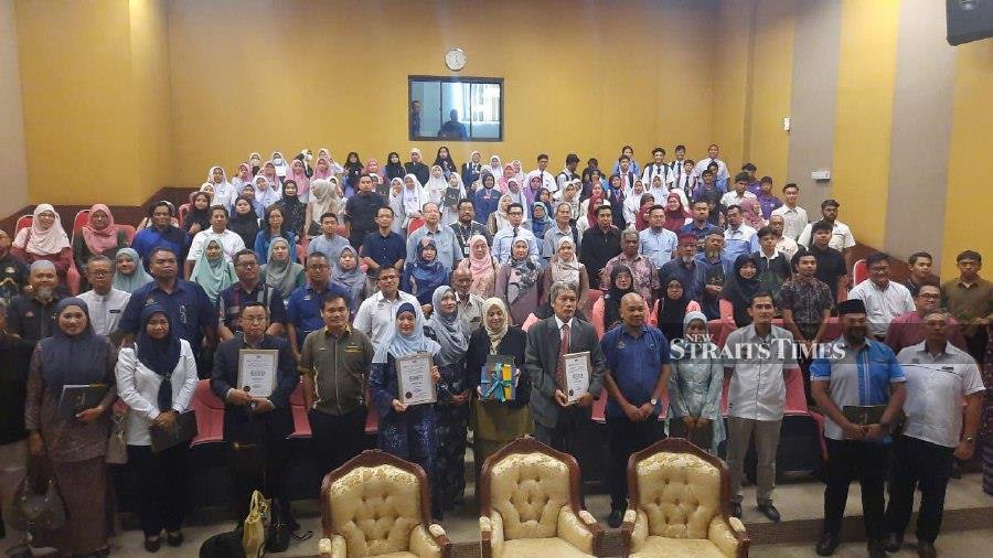 National Heritage Department’s World Heritage Division Director, Mohd Syahrin Abdullah (standing, third from left) with the "Sungai Lembing past, present and future historical narrative" programme in Kuantan today. - NSTP/ Asrol Awang