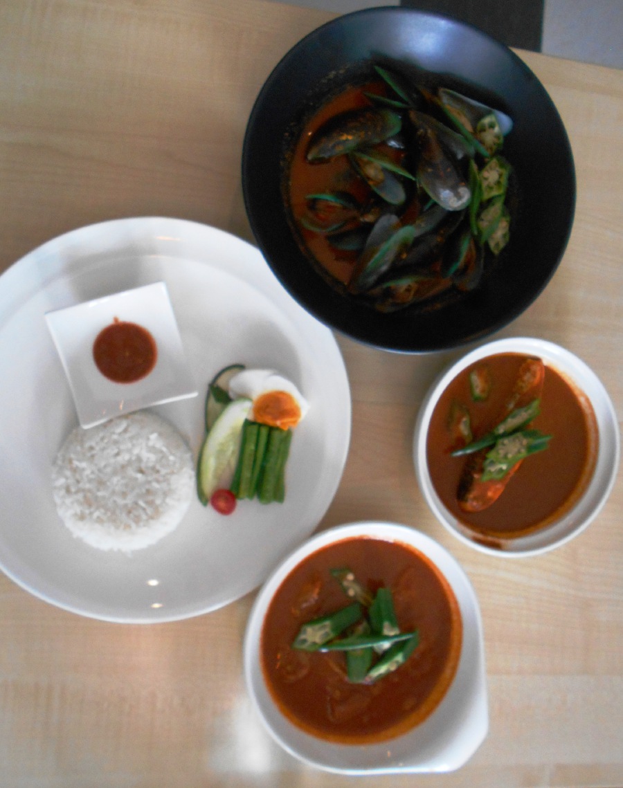Three varieties of Chef Ibrahim’s asam pedas (clockwise from top) with mussels, salmon and otak-otak. Each set comes with white rice, salted egg, ulam and sambal belacan. Pix by Zaaba Johar