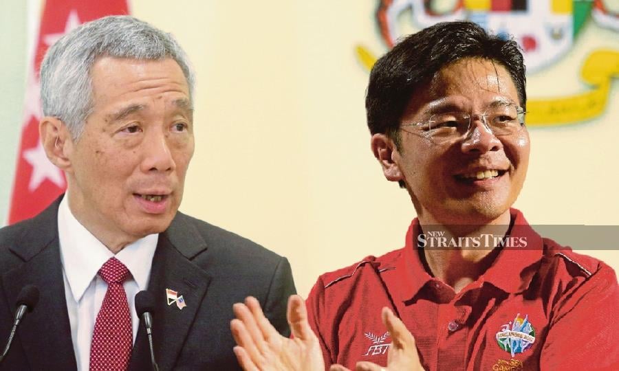 Lee Hsien Loong (left) will hand over power to his successor, Lawrence Wong, on May 15.