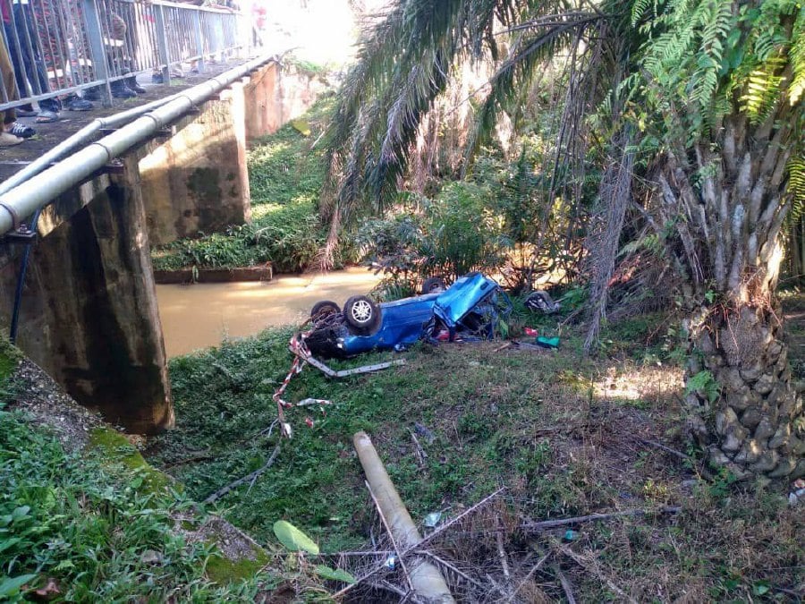 A woman was killed and her Felda manager husband seriously injured when the car they were in plunged off a bridge at Km2 Jalan Jalan Sungai Koyan-Raub yesterday. Photo courtesy of police