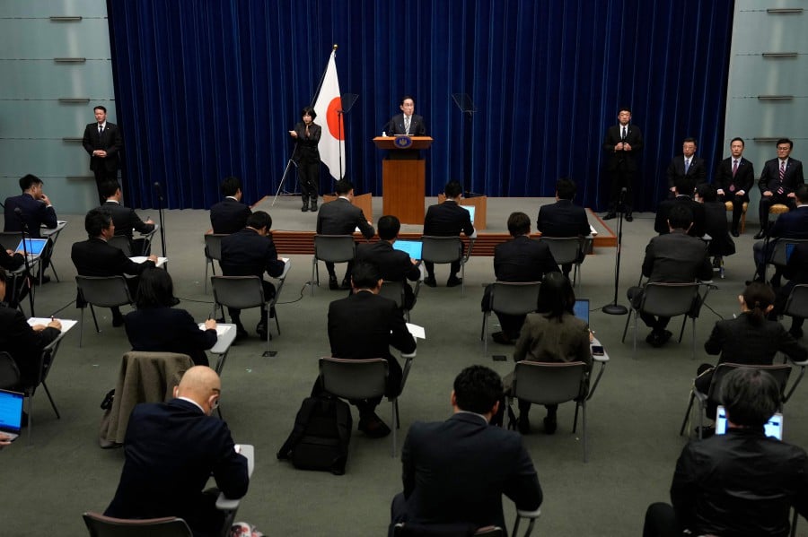Japanese Prime Minister Fumio Kishida (C) delivers a news conference at the Prime Minister's Office in Tokyo. - AFP PIC