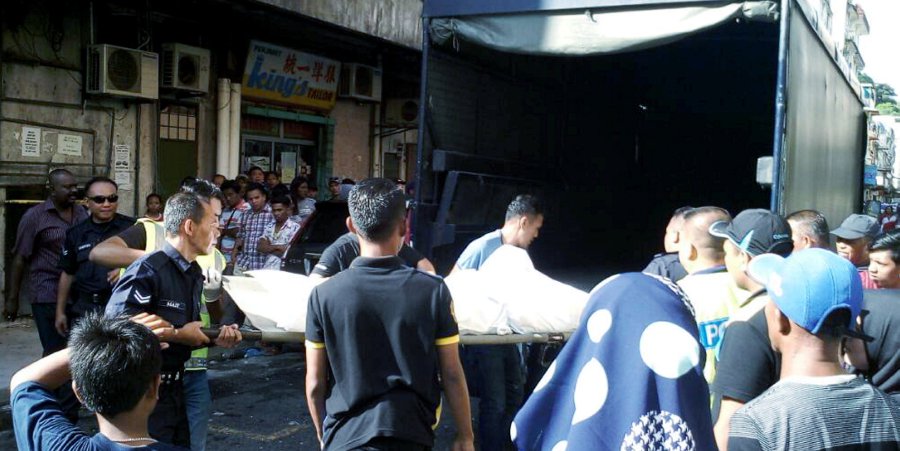 A woman was found dead in a lodging room at Jalan Dua here, today. Pic by STR/HAZSYAH ABDUL RAHMAN
