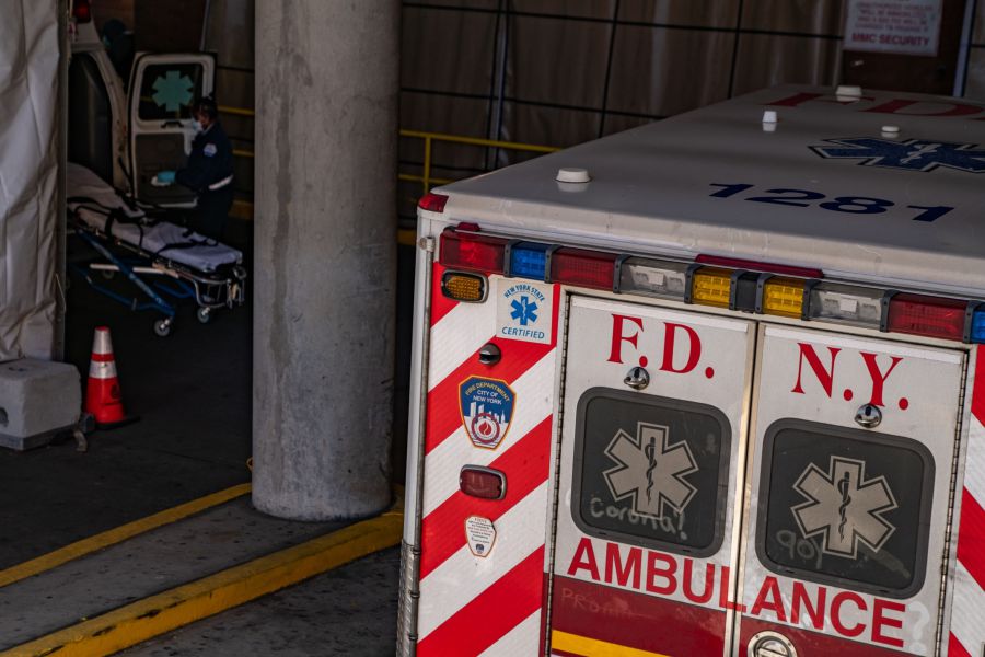 A Fire Department of New York (FDNY) ambulance sits outside the emergency room at Montefiore Hospital in the Bronx borough of New York, U.S., on Thursday, April 2, 2020. In four months, the new coronavirus infected more than 1 million people and killed more than 51,000. The U.S. accounts for a quarter of the cases. Photographer: David Dee Delgado/Bloomberg