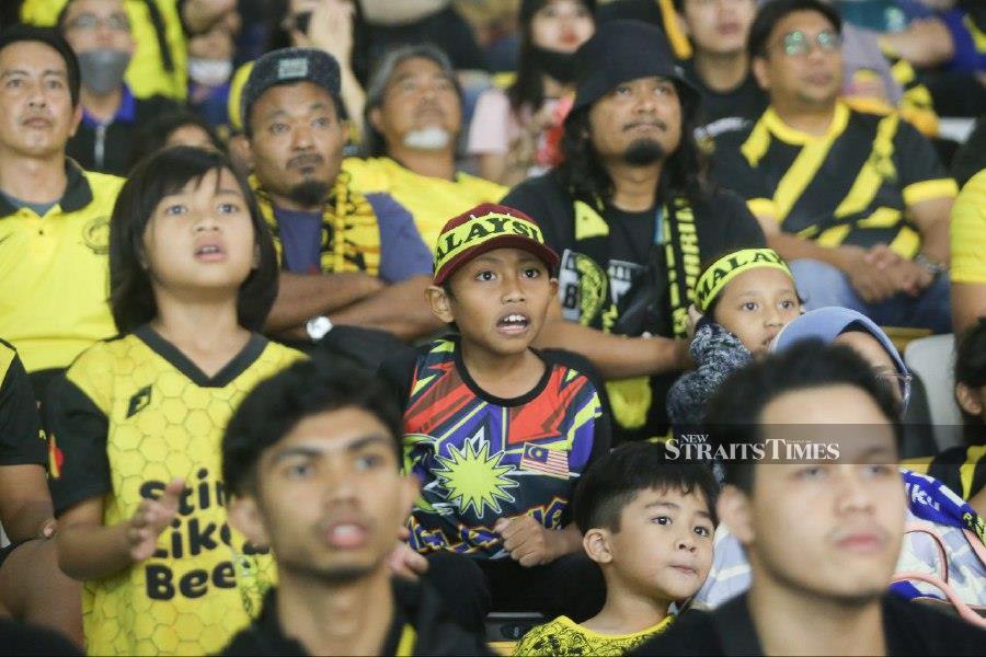 Harimau Malaya fans look on during the match against Bahrain at Bukit Jalil National Stadium. - NSTP/GENES GULITAH