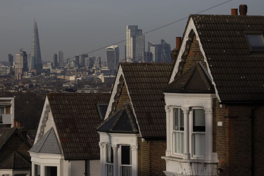 A terrace of residential houses in the Dulwich district in view of skyscrapers in the City of London, U.K., on Tuesday, Nov. 24, 2020. Asking prices for U.K. homes slipped this month as owners sought to get sales agreed in time to benefit from a temporary tax cut. Photographer: Simon Dawson/Bloomberg