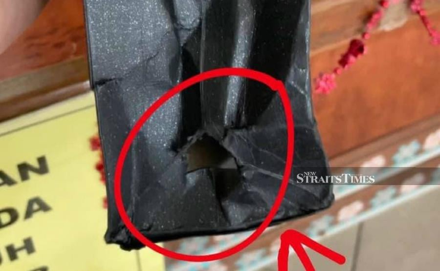 The paper bag used by the suspect, where he hid a smartphone. - NSTP/Courtesy of police. 