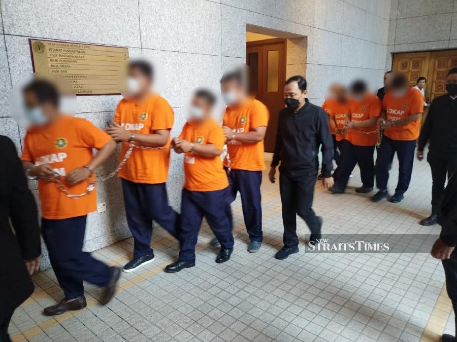 Some of the suspects seen arriving a the Putrajaya magistrate’s court ahead of obtaining their remand order. - Pic courtesy of MACC