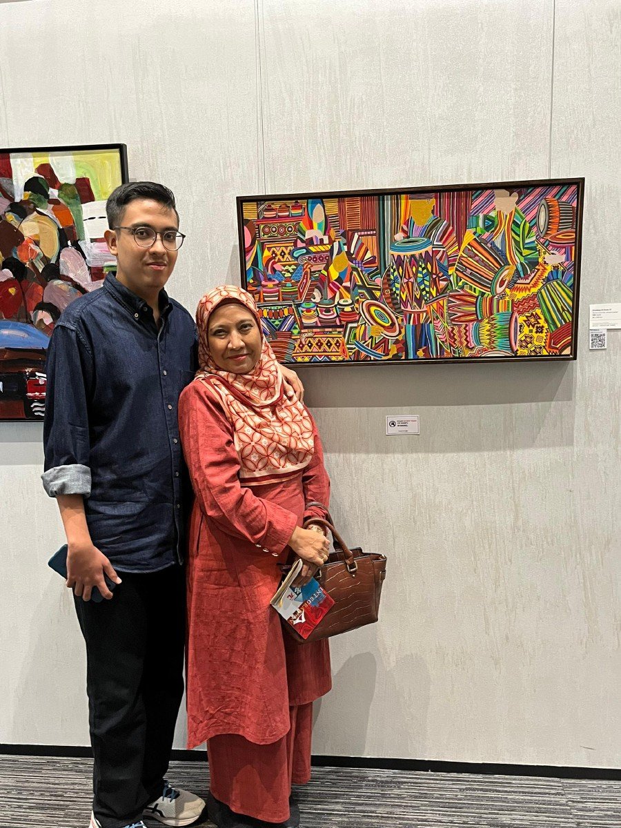 A mother’s love and dedication - Rohani, with Danial, who’s now a successful artist. 