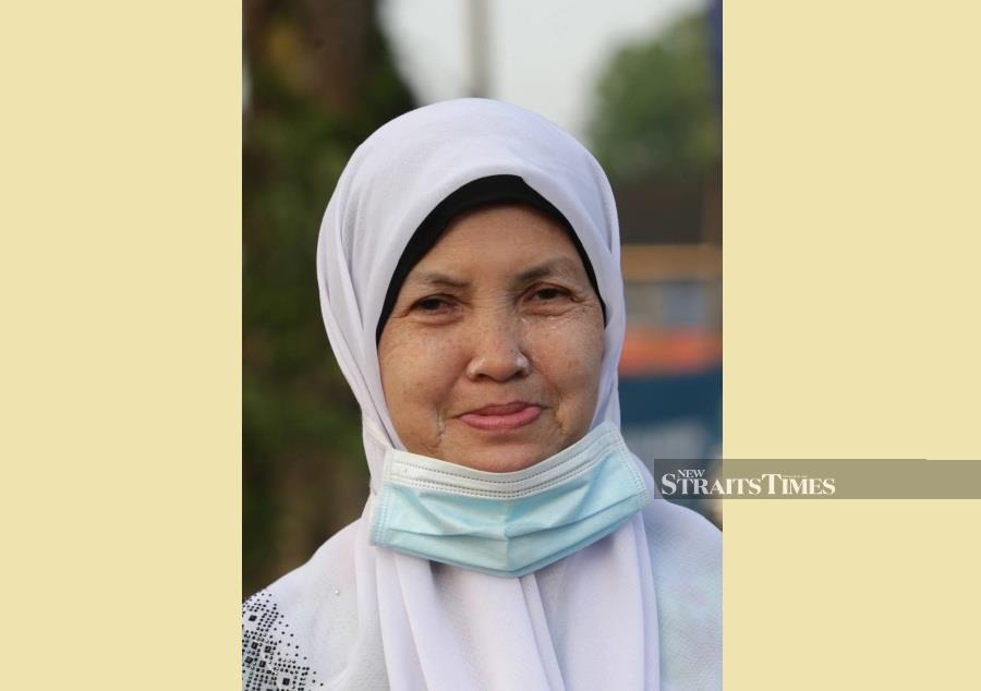 Maimunah Abdul Rahim said despite going for holiday today, it was still her duty to cast her ballot in the Johor state election. - NSTP/MOHAMAD SHAHRIL BADRI SAALI.