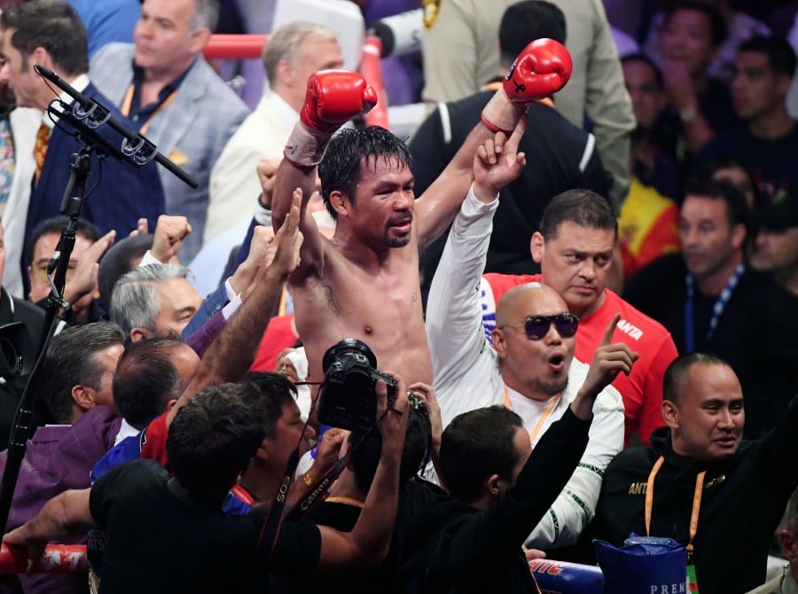 In this file photo taken on July 20, 2019 Manny Pacquiao celebrates his split-decision victory over Keith Thurman in their WBA welterweight title fight at MGM Grand Garden Arena on in Las Vegas, Nevada. - AFP pic