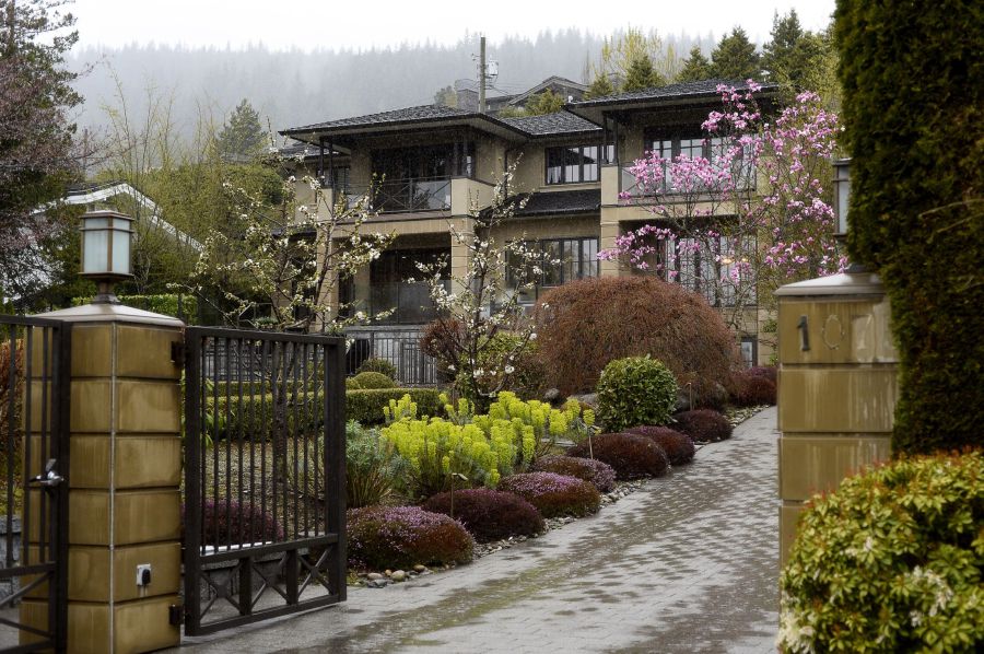 Rain falls outside a mansion for sale in West Vancouver, British Columbia, Canada, on Wednesday, April 10, 2019. Government policies to tame the housing market -- from new taxes to stricter mortgage regulations -- have fueled a plunge in sales to the weakest since the global financial crisis. Prices are down 8.5 percent from their peak in June, according to the Real Estate Board of Greater Vancouver. Photographer: Jennifer Gauthier/Bloomberg