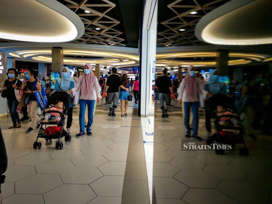 This Dec 6, 2020, file pic shows shoppers wearing face mask amidst the Covid-19 pandemic, at a mall in Kuala Lumpur. -NSTP/File pic