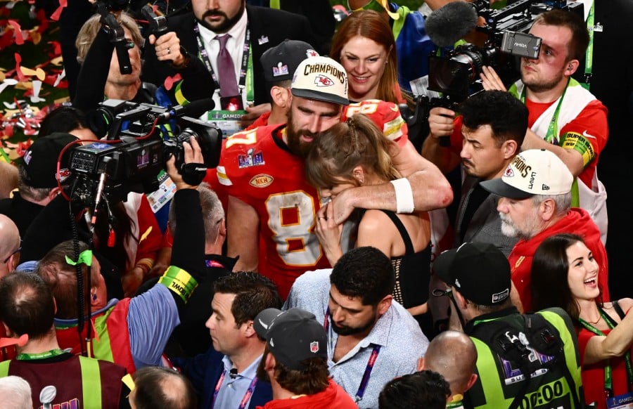 US singer-songwriter Taylor Swift and Kansas City Chiefs' tight end Travis Kelce embrace after the Chiefs won Super Bowl LVIII against the San Francisco 49ers at Allegiant Stadium in Las Vegas, Nevada. - AFP PIC
