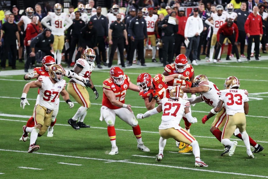 Travis Kelce of the Kansas City Chiefs runs the ball after a catch in overtime against the San Francisco 49ers during Super Bowl LVIII at Allegiant Stadium in Las Vegas, Nevada. -AFP PIC