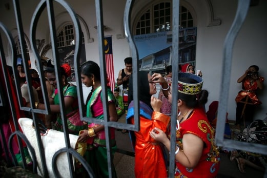 Participants are busy getting ready for the Merdeka parade at Dataran Merdeka. Pix by Sairein Nafis