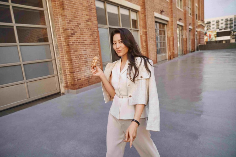 Arden Cho turns heads in a belted tailored vest, tweed jacket and tailored high rise pants.