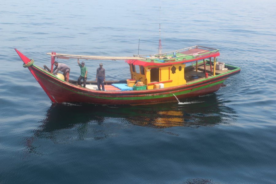 Two fishing boats with nine Indonesian crew members have been detained during two separate checks and inspections here yesterday on suspicion of trespassing into Malaysian waters. - Pic courtesy of MMEA.