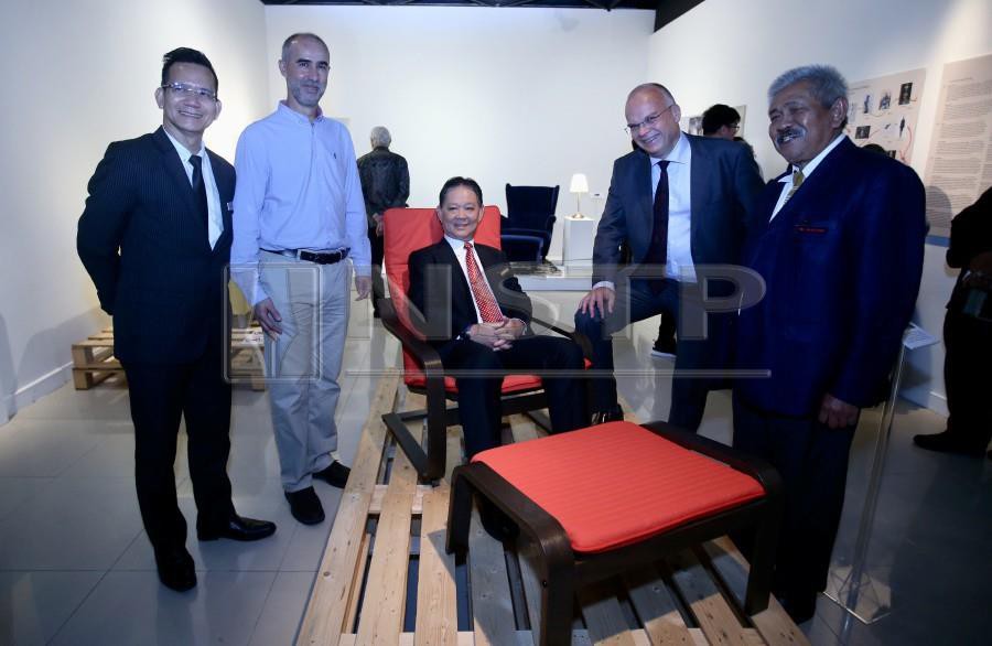 Tourism Minister Datuk Mohamaddin Ketapi (seated) tries one of products from Ikea as National Arts Gallery director-general, Profesor Datuk Dr Mohamed Najib Ahmad Dawa (right) and Swedish Ambassador Dag Juhlin-Dannfelt (2nd-right)look on during the launch of the Swedish Fashion and Design Stories at National Arts Gallery. - NSTP/ NURUL SHAFINA JEMENON