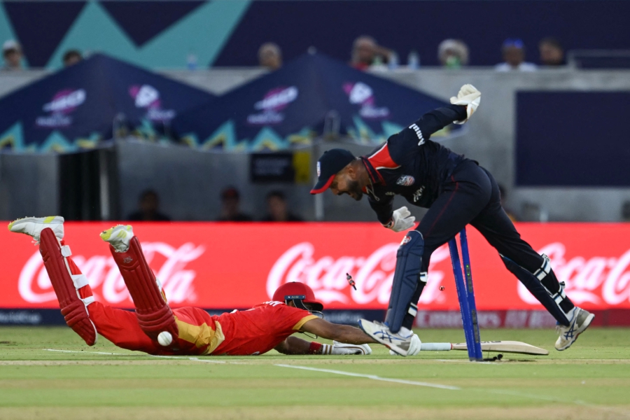 Canada’s Pargat Singh (left) is run out by US’ captain Monank Patel during the Twenty20 World Cup 2024 Group A match at the Grand Prairie Cricket Stadium in Grand Prairie, Texas on Saturday. - AFP PIC