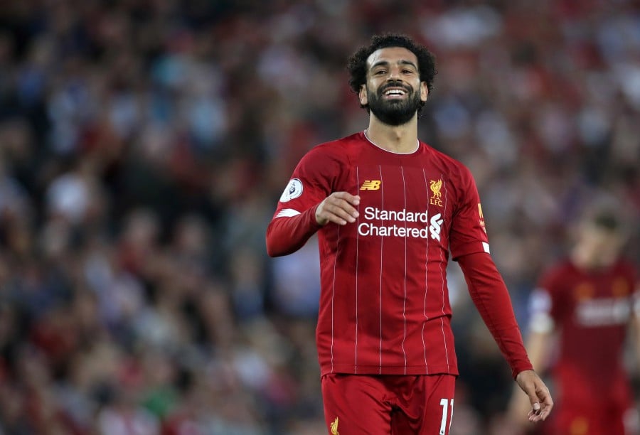 Salah comforts star-struck Liverpool fan who injured nose ...