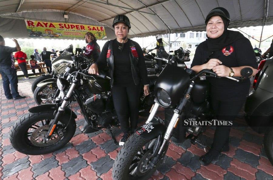 Mimi Musa (left) and Nor Hanani Yusof (right) confidently piloting their own high-powered bikes, leaving many to marvel at their adventurous spirit. - NSTP/NIK ABDULLAH NIK OMAR